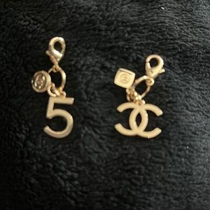 COPY - Chanel clip ons. One no 5 and one CC. Authentic clip ons with Chanel fra…